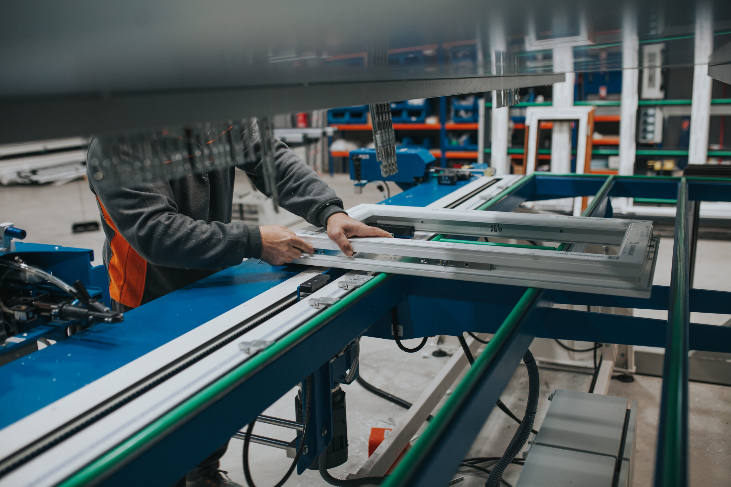midsection manual worker making window frame factory